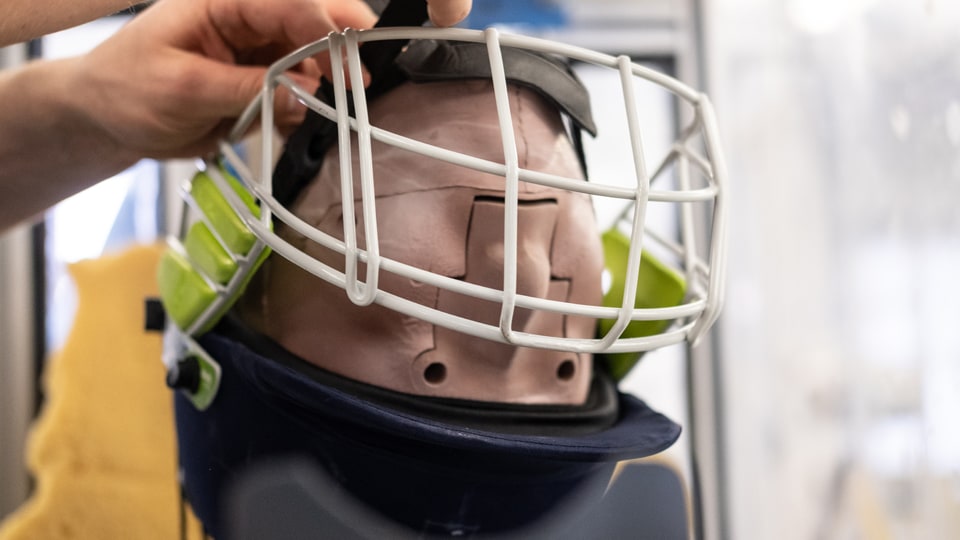 Photograph showing the set up of a lab-based helmet test