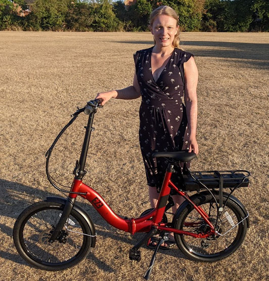 Competition winner Steph Oldham with her prize - a folding bicycle