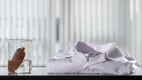 A choc-ice beside a white lab coat