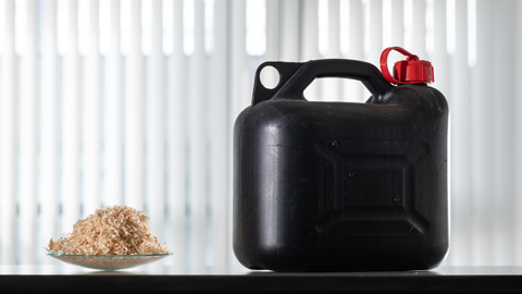 A dish of woodchips beside a petrol can