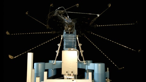 Golf machine swinging a club