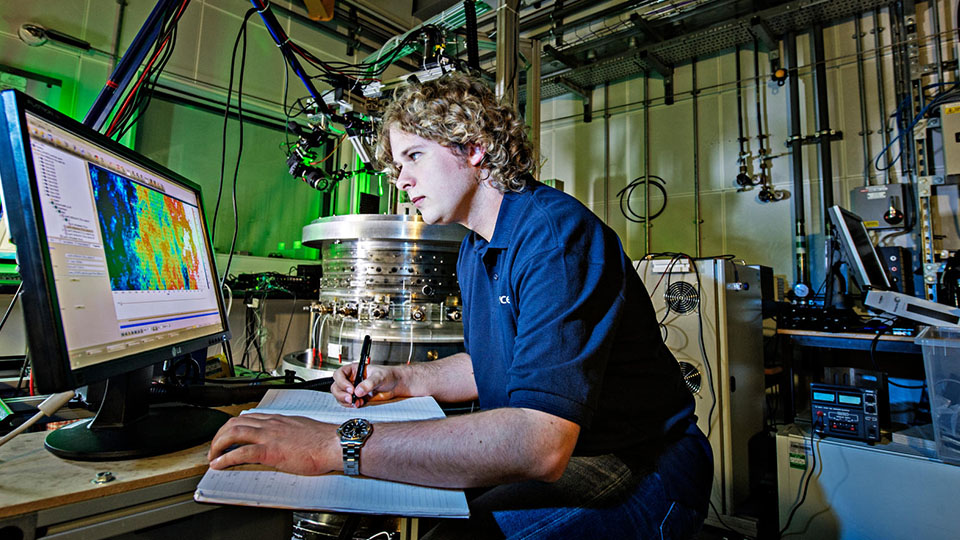 a researcher using equipment inside a Rolls Royce UTC workshop