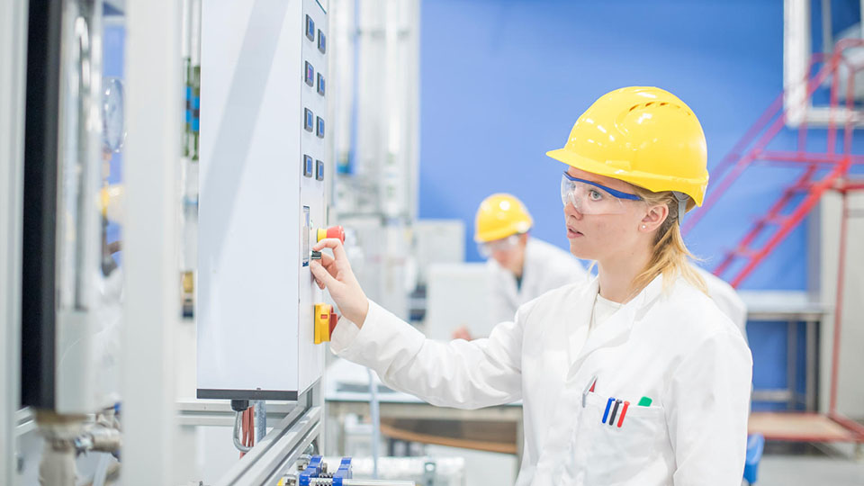 a student using equipment in a Chemical Engineering workshop