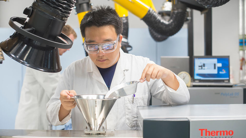 a student using equipment in a Materials Engineering lab