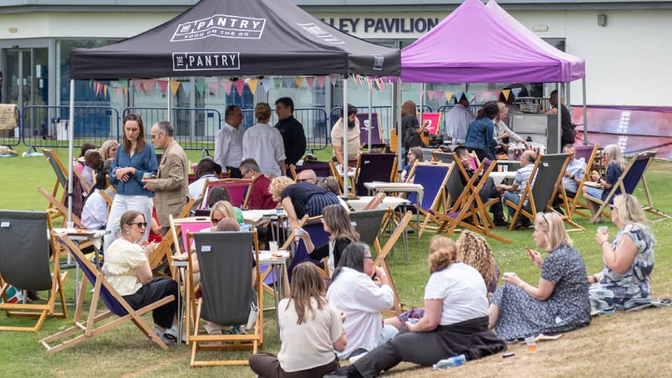 Loughborough Business School staff sat outside under gazebos at the Staff Celebration 2026.