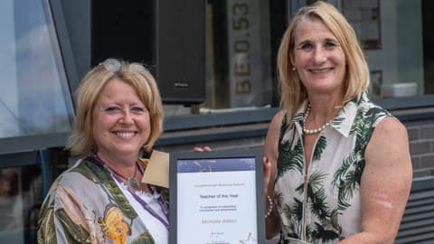Cheryl Travers collects the Teacher of the Year Award on behalf of Michelle Aitken.