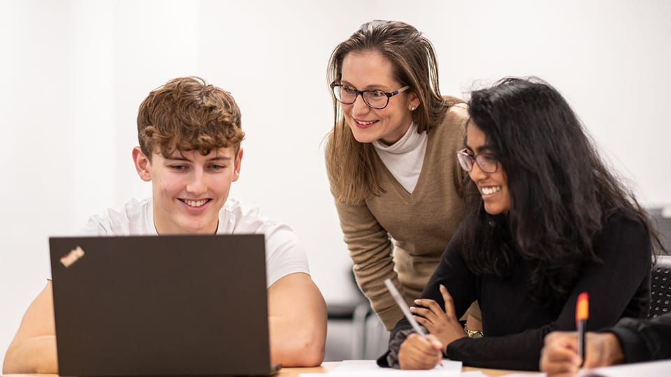 3 students at laptop