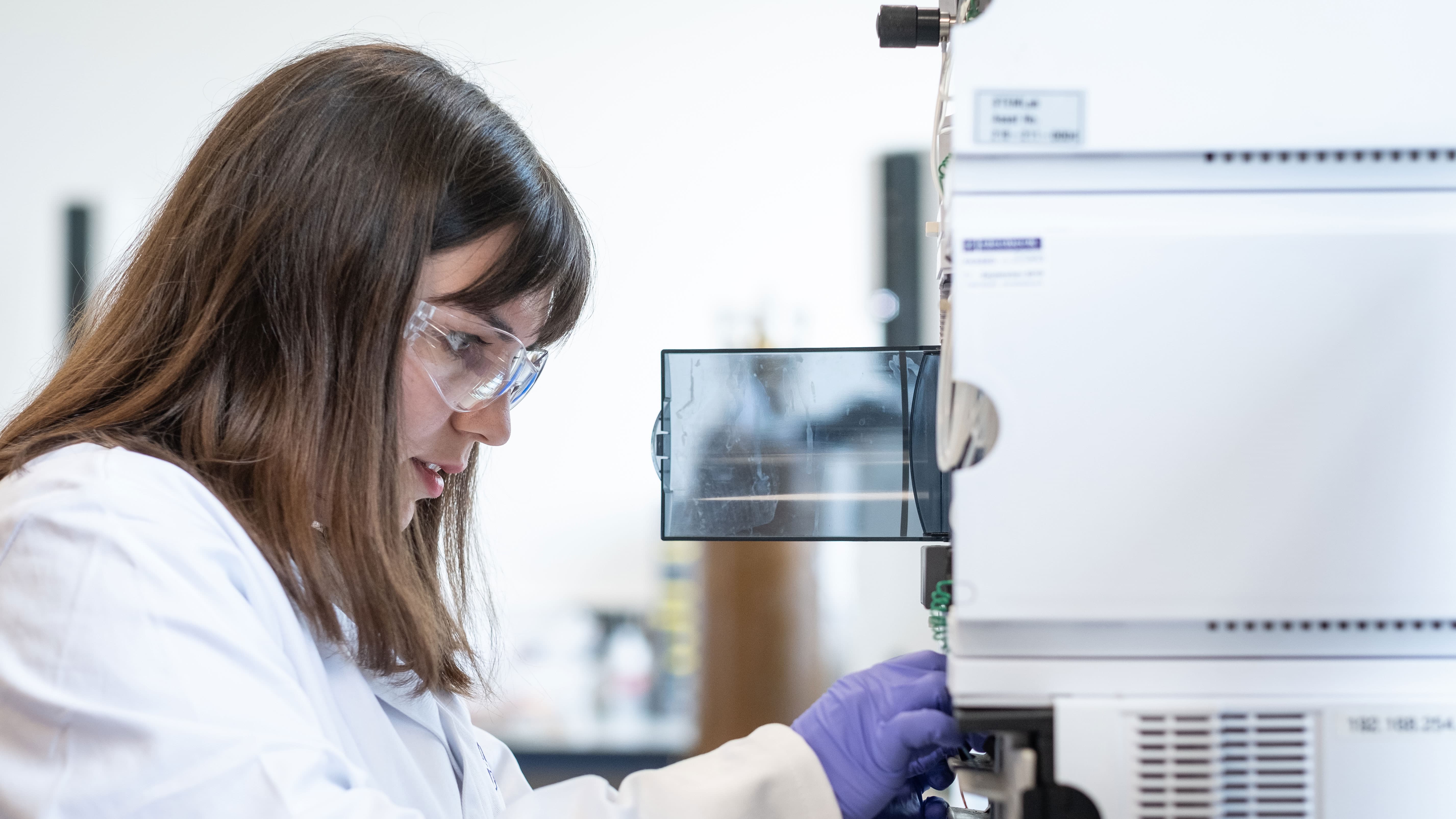 Master's student Melis using equipment in the instrumentation chemistry lab