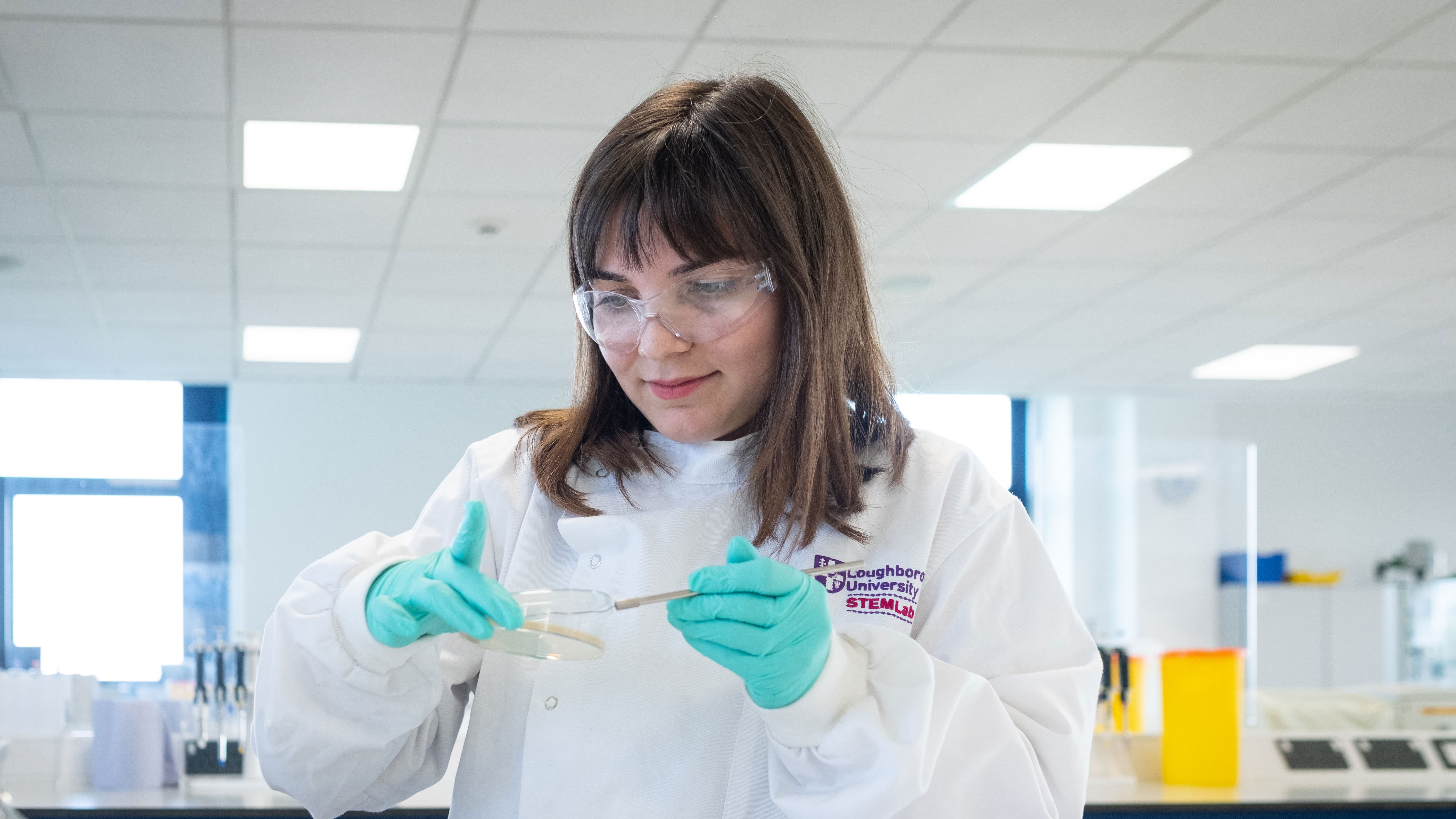 Master's student Melis conducting an experiment in the bio laboratory