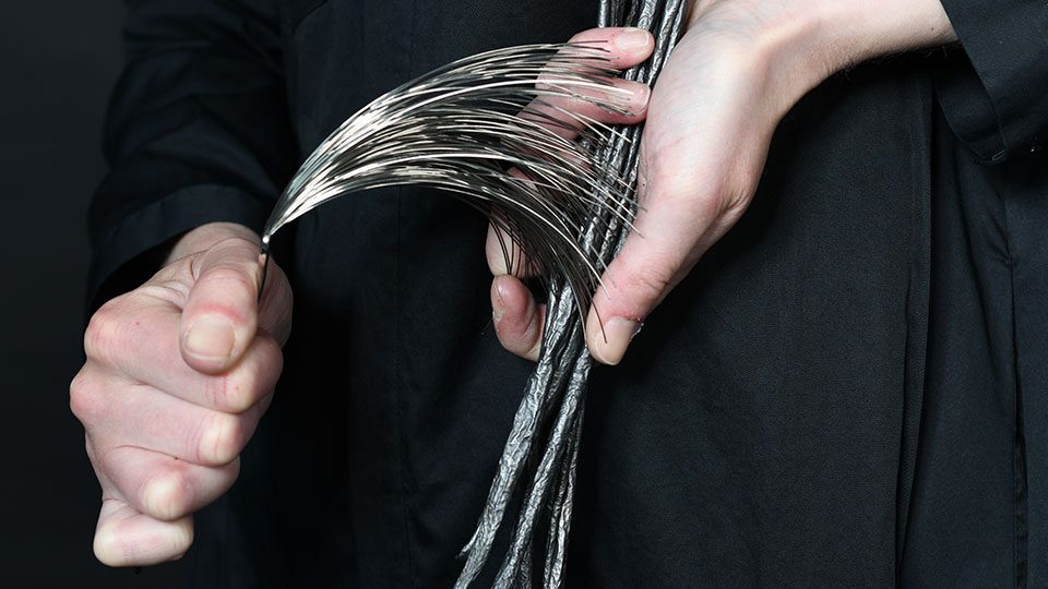 Rachael Colley, Melon skin, graphite, stainless steel: ‘H(old)iii’