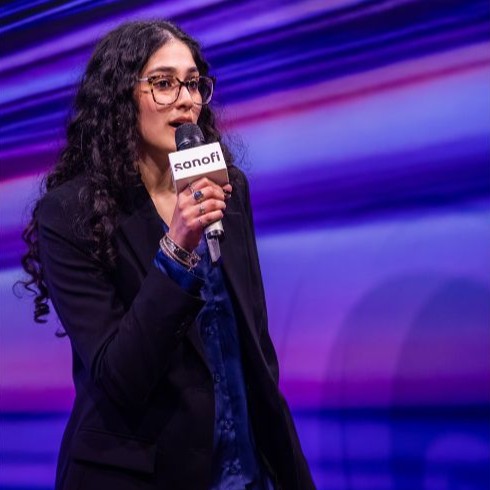 Damini, Industrial Design student, speaking through a microphone