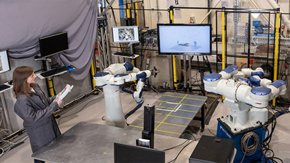 Aerial view of a female engineering operating equipment in the Intelligent Automation Centre