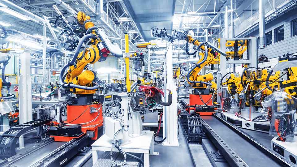 Robotic arms in a car plant