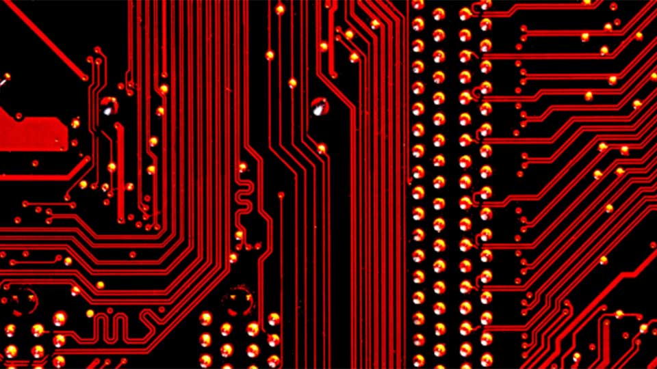 Red lines and shapes on a black background representing electronics