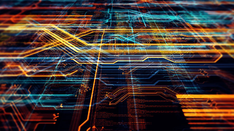 An abstract digital network of glowing orange, yellow, and blue light streaks and circuitry tracks.