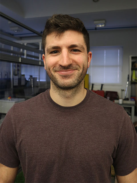 Close up of James, smiling into the camera.