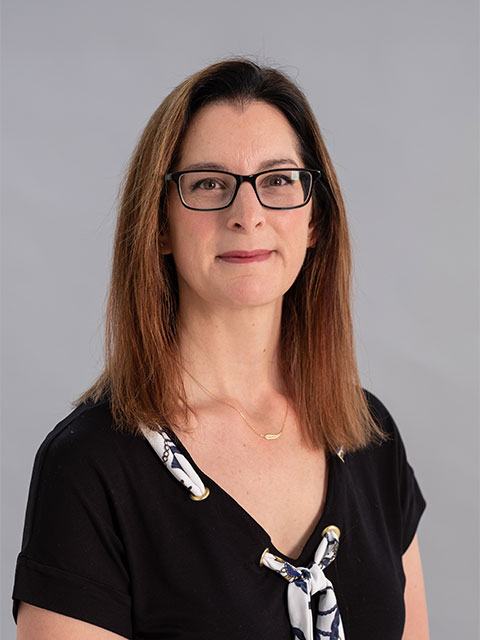 Headshot of Melanie, looking directly at the camera