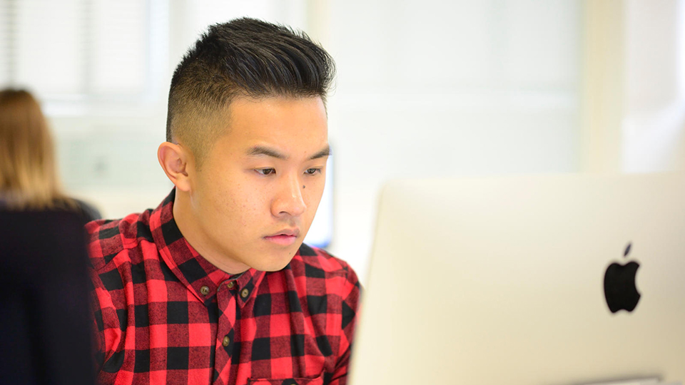 Student using a computer suite