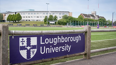 Loughborough University sign on side of the sports pitch 