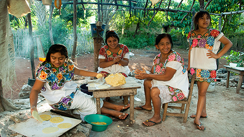 Members of Maya community preparing food. Image by Miguel Cetina