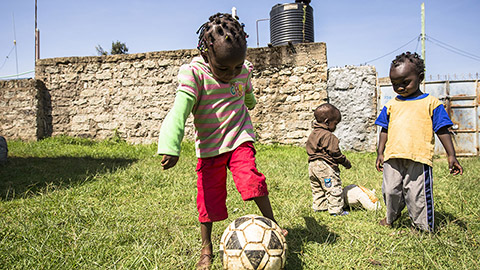 Child playing football