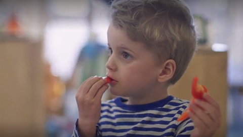 child eating a carrot