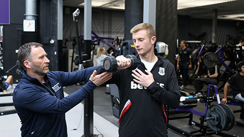 Dr Paul Sanderson working with a student in the Powerbase Gym at Loughborough University