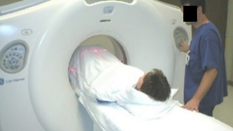 A patient undergoing a CT scan