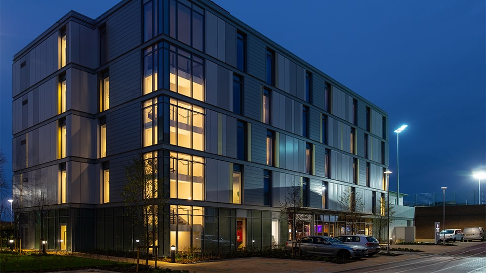 Elite Athlete Centre and Hotel building at dusk.