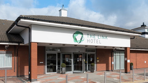 The Link Hotel entrance and building.