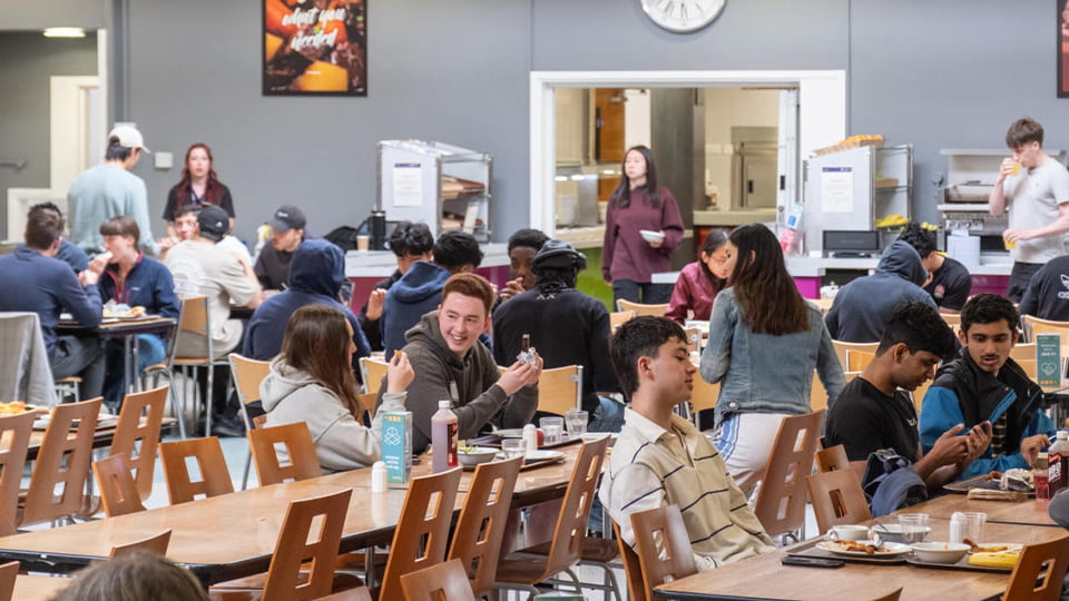 Students in Elvyn Richards dining hall eating a nutritious meal just minutes away from their accommodation at Loughborough University campus