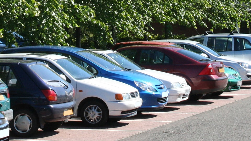 Cars in a car park on a sunny day
