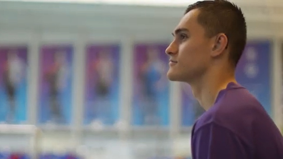 Henry sat by a swimming pool