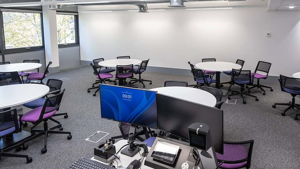 Keith Green Teaching Hub - KTG103 - first floor teaching space with several circular white desks and plenty of natural light