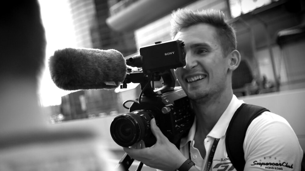 Adam Dismore using a video camera