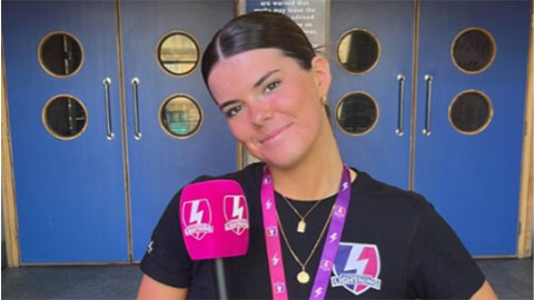 Annabel, holding a Loughborough Lightning microphone