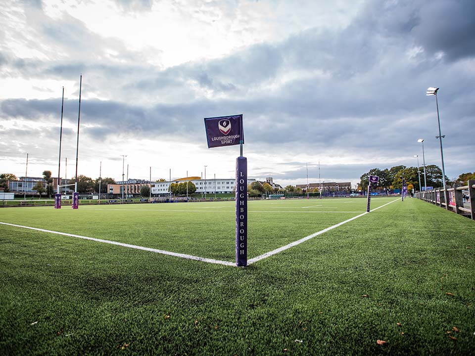 A empty artificial rugby pitch and Loughborough Sport corner flag.