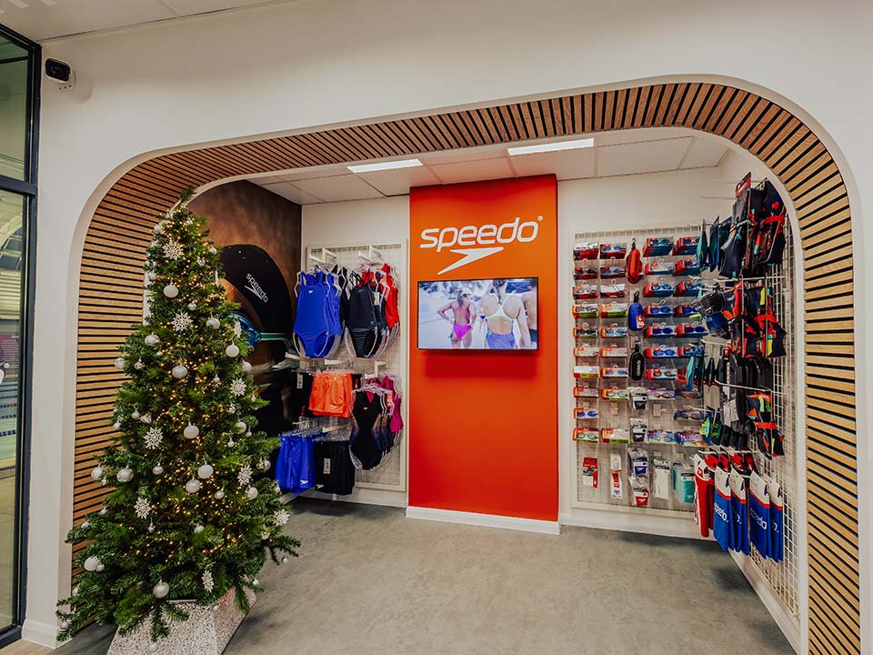 A Speedo shop is stocked with goggles, swim costumes and other swimming accessories.