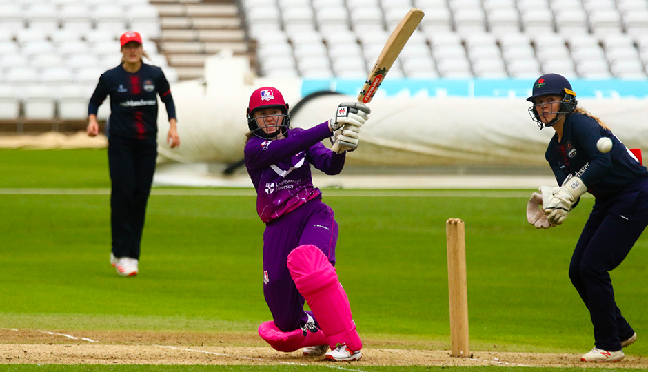 women playing cricket