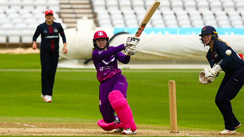 Women playing cricket