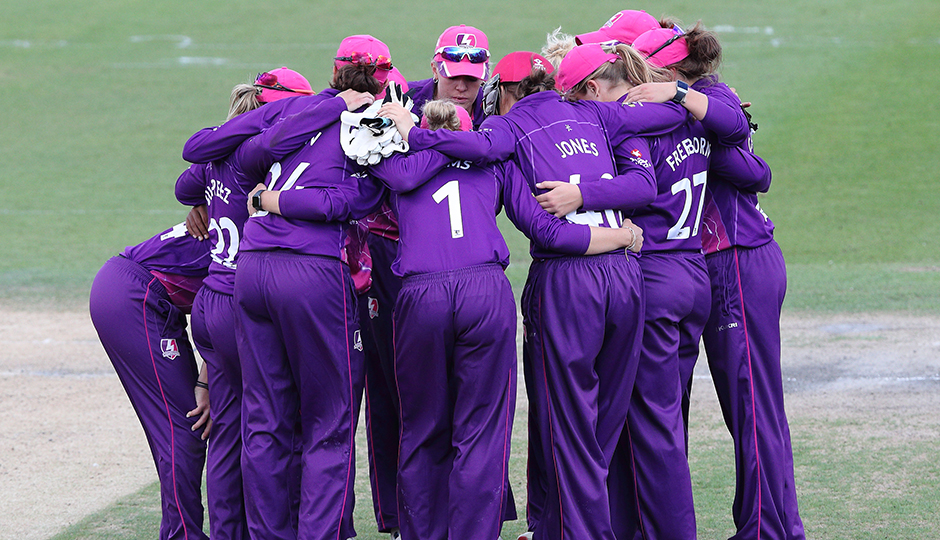 women cricketers in a team talk