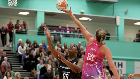 Nicola Smith intercepting a high ball against a Mavericks attacker