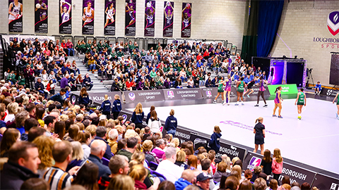 spectators and players on court