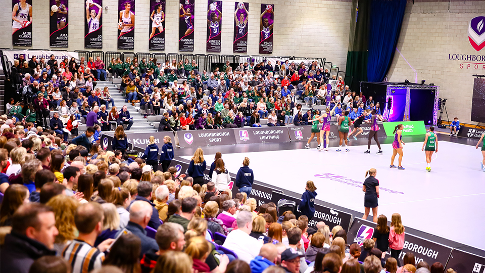 spectators and players on court