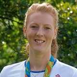 Nicola White wearing a medal around her neck