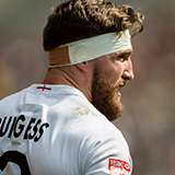 Phil Burgess wearing England Rugby Sevens short with his name on the back