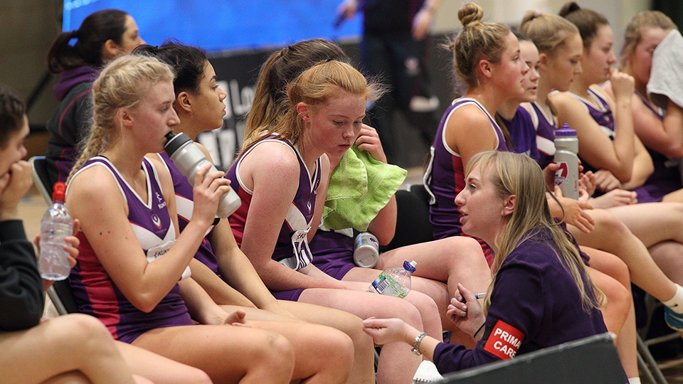 Sam Griffin talking to the members of the netball team