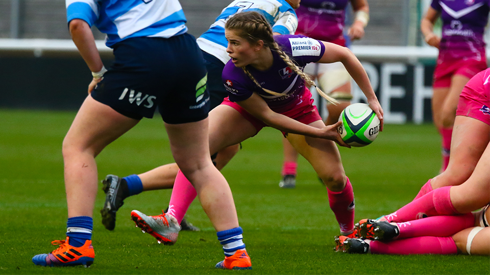 close up of women's rugby players on the pitch