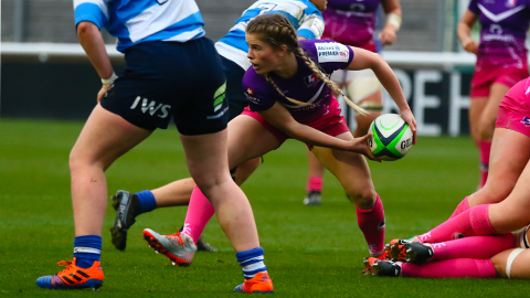 close up of women's rugby players on the pitch