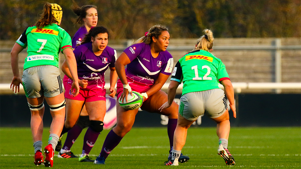 close up of women's rugby players on the pitch